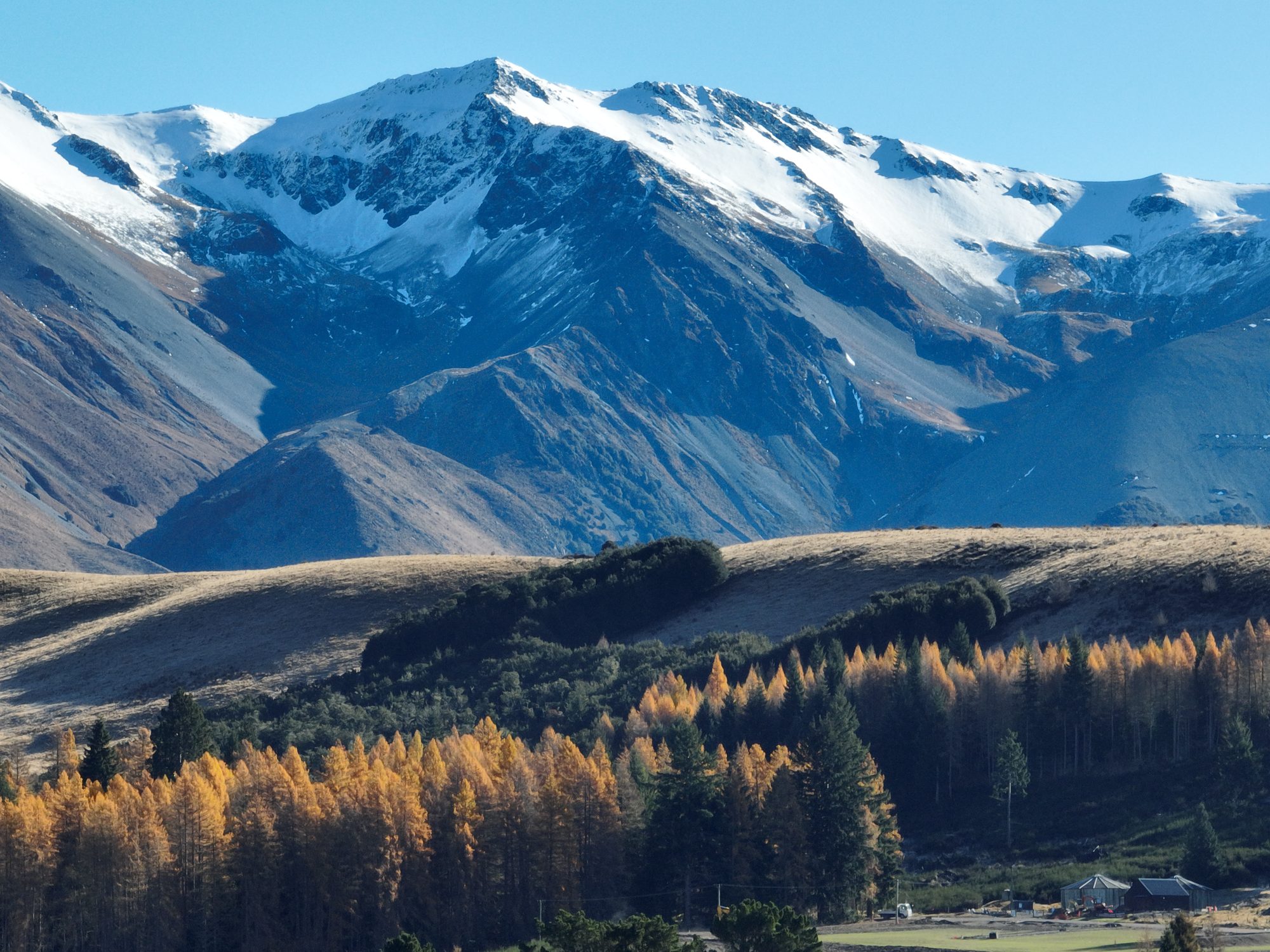 Canterbury high country panorama with autumn larches and snow-capped peaks — a typical Ride Sherpa day-trip destination